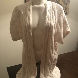 Soft, short sleeved, cable knitted sweater.